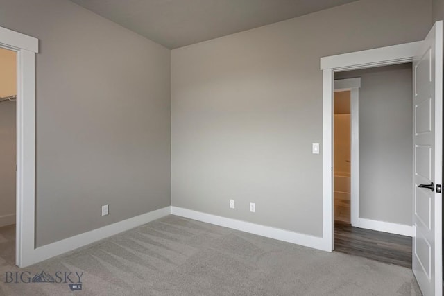 2133 Stewart Loop, Bozeman, MT 59718 - unfurnished bedroom featuring carpet flooring, a spacious closet, and a closet