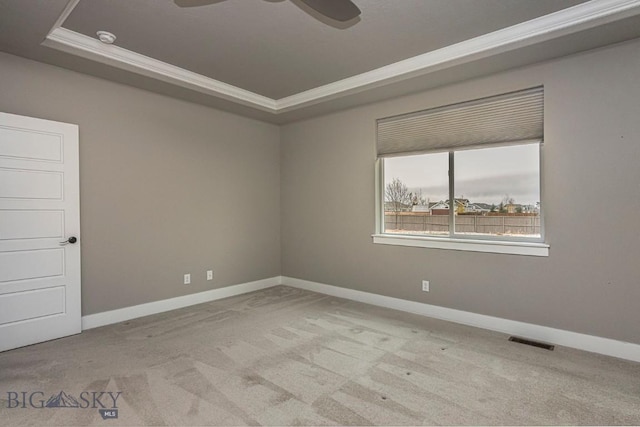 2133 Stewart Loop, Bozeman, MT 59718 - spare room featuring a raised ceiling, carpet flooring, crown molding, ceiling fan, and a smoke detector