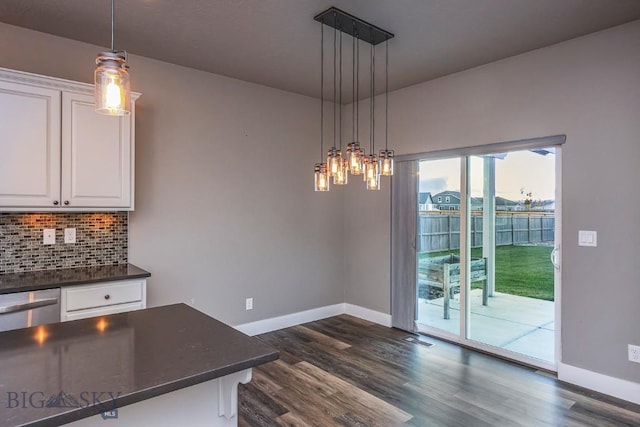 2133 Stewart Loop, Bozeman, MT 59718 - unfurnished dining area featuring dark wood finished floors and a chandelier