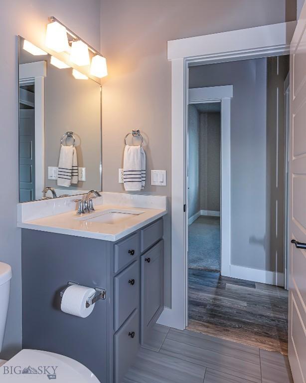 2133 Stewart Loop, Bozeman, MT 59718 - half bathroom featuring vanity and wood finished floors