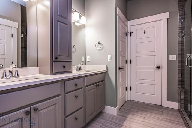 2133 Stewart Loop, Bozeman, MT 59718 - bathroom with double vanity, a stall shower, and wood tiled floors