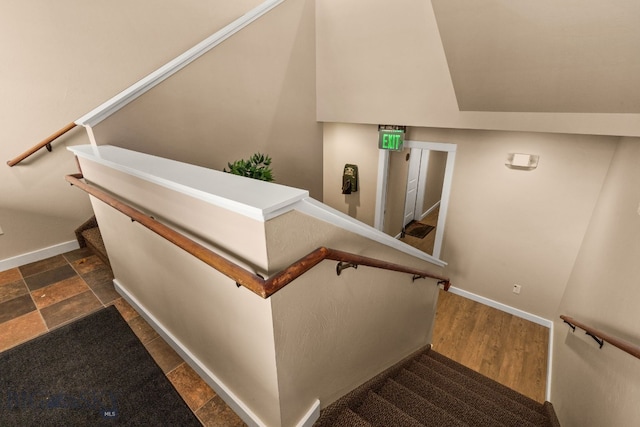 stairs with hardwood / wood-style flooring