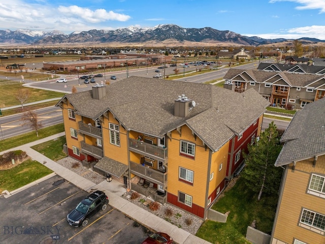 drone / aerial view featuring a mountain view