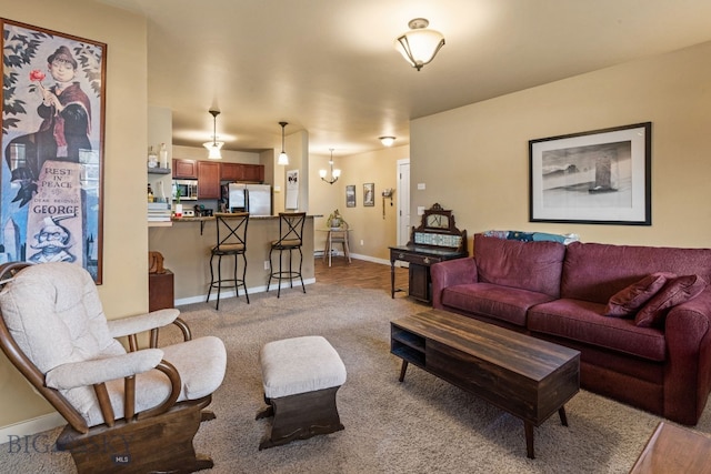 living room with an inviting chandelier