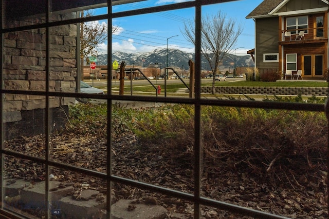 view of yard featuring a mountain view and a playground