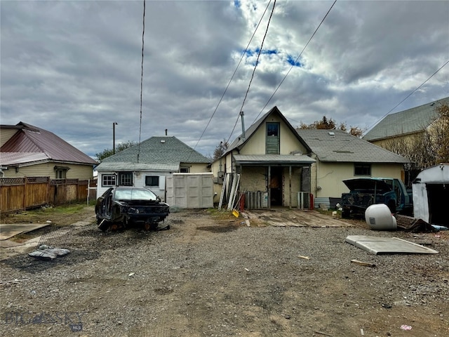 back of house featuring cooling unit