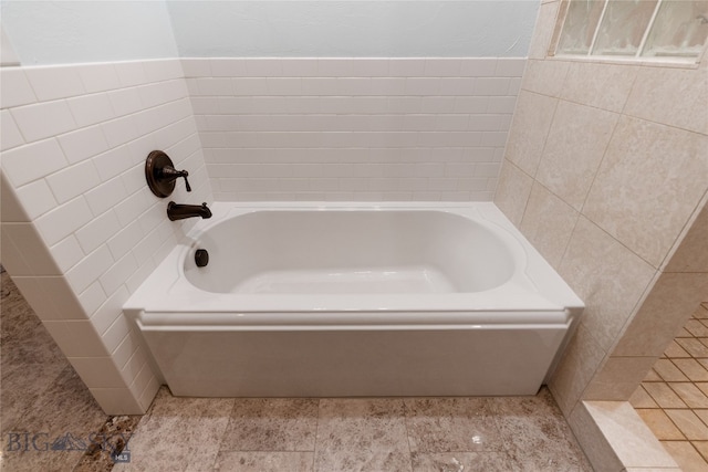 bathroom featuring a tub