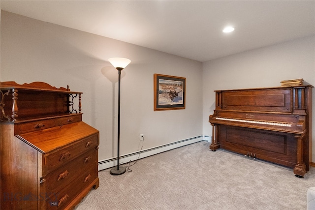 miscellaneous room featuring light carpet and a baseboard heating unit