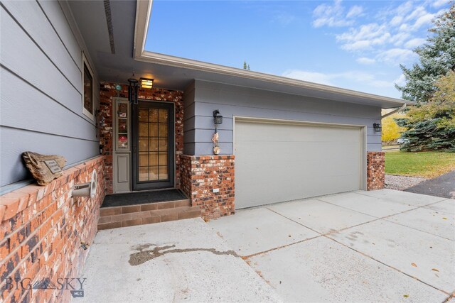 entrance to property featuring a garage