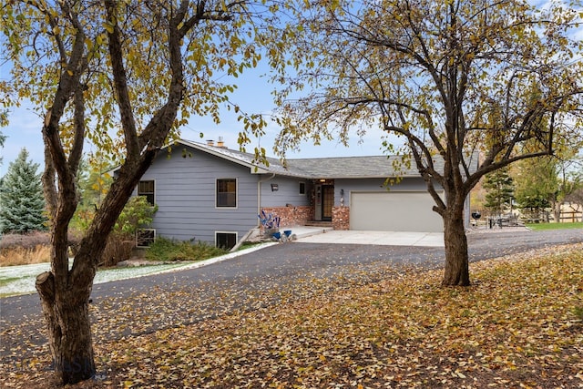 ranch-style house featuring a garage