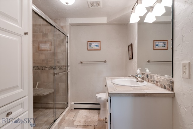 bathroom featuring vanity, a baseboard radiator, a shower with shower door, and toilet