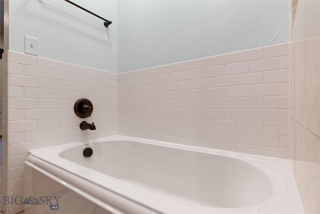 bathroom featuring a tub