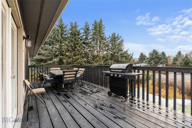 wooden deck with area for grilling