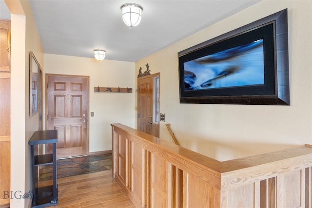 corridor featuring light hardwood / wood-style floors