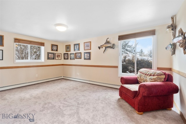 living area featuring carpet and baseboard heating