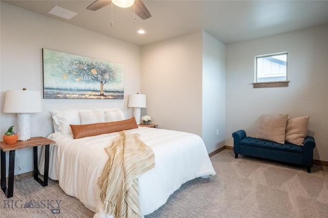 bedroom featuring ceiling fan and light colored carpet