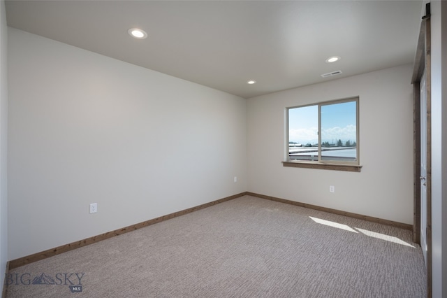 spare room featuring carpet flooring