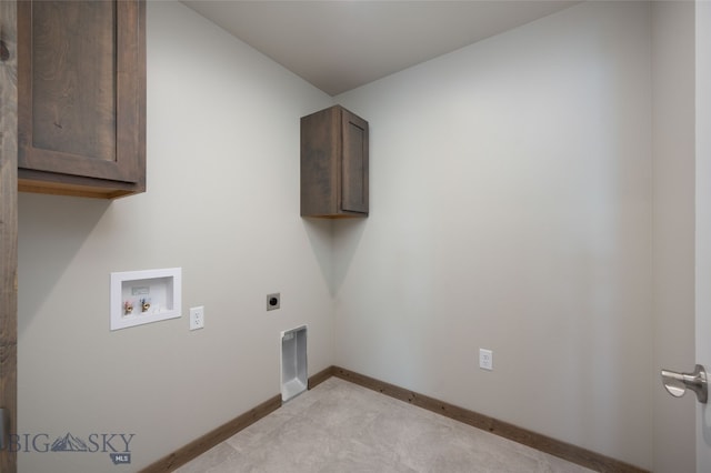 washroom featuring hookup for an electric dryer, cabinets, and hookup for a washing machine