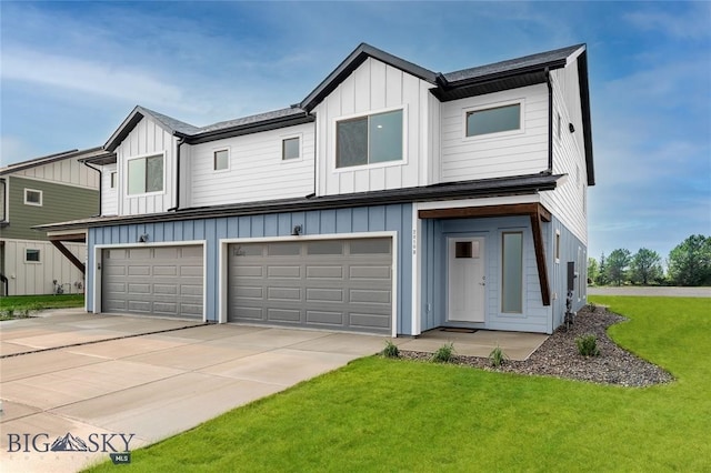 view of front facade with a garage and a front lawn