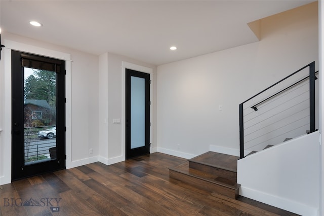 entryway with dark hardwood / wood-style floors