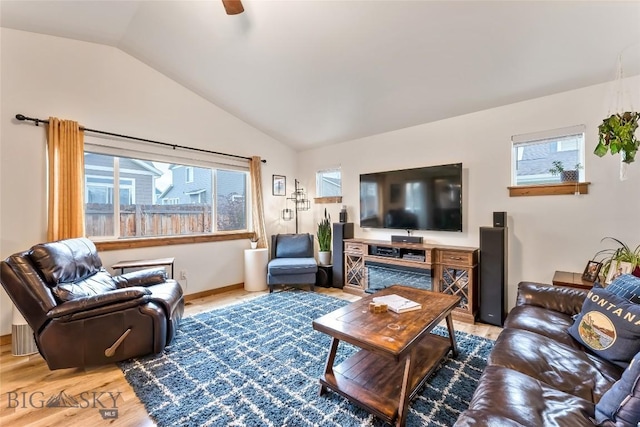 living room featuring ceiling fan, lofted ceiling, and hardwood / wood-style floors