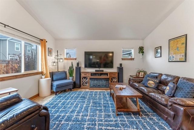 living room featuring hardwood / wood-style flooring and vaulted ceiling