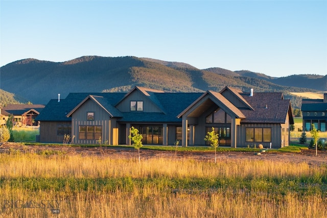 back of house featuring a mountain view