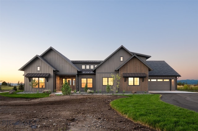 modern inspired farmhouse featuring a garage