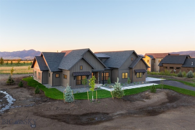 modern farmhouse style home featuring a mountain view