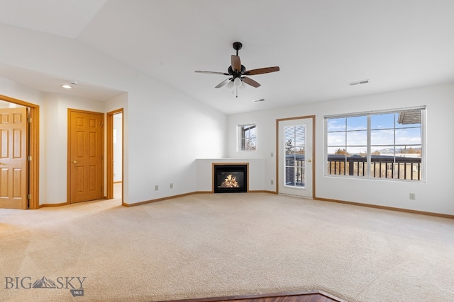 unfurnished living room featuring light carpet, ceiling fan, and vaulted ceiling