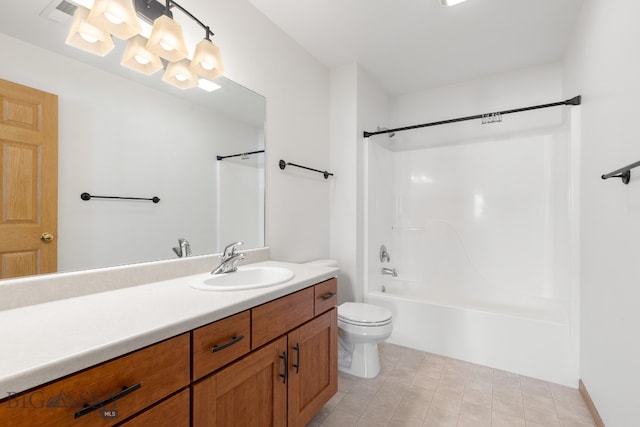 full bathroom featuring tile patterned floors, vanity, toilet, and shower / washtub combination