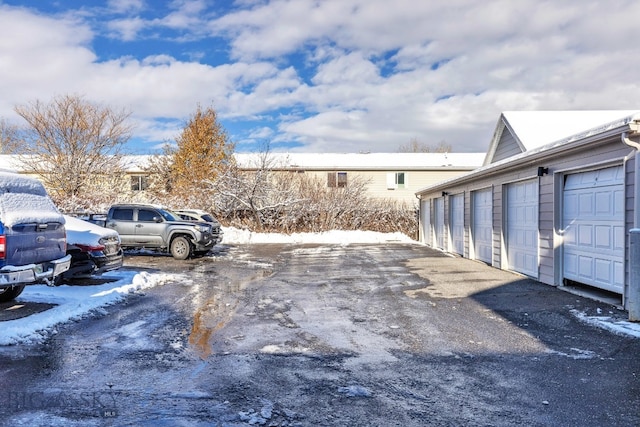 view of snow covered parking