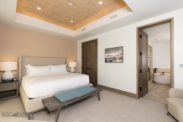 carpeted bedroom featuring a raised ceiling, wooden ceiling, and a closet