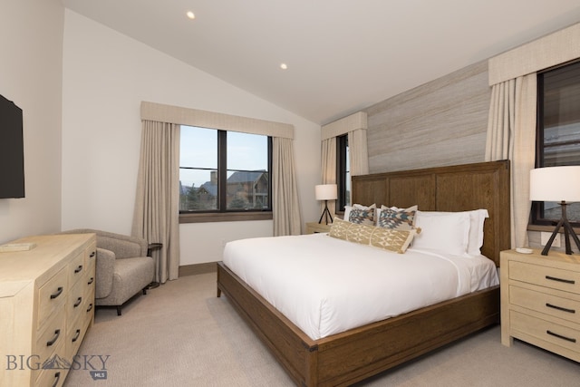 carpeted bedroom featuring vaulted ceiling