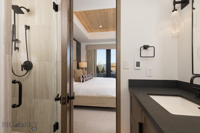 117 Martingale Frk Unit 6, Big Sky, MT 59716 - ensuite bathroom with a shower stall, a tray ceiling, and vanity
