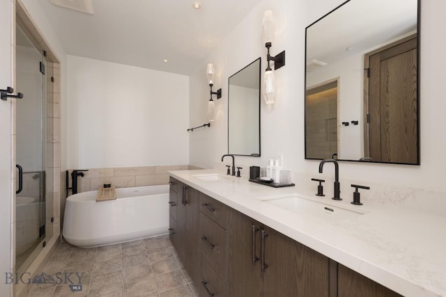 117 Martingale Frk Unit 6, Big Sky, MT 59716 - full bath featuring a soaking tub, double vanity, a shower stall, and tile patterned floors