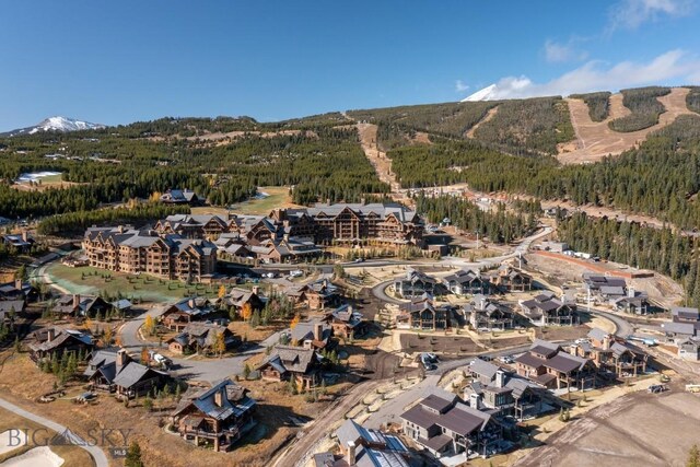 117 Martingale Frk Unit 6, Big Sky, MT 59716 - aerial view of property's location featuring mountains and a heavily wooded area
