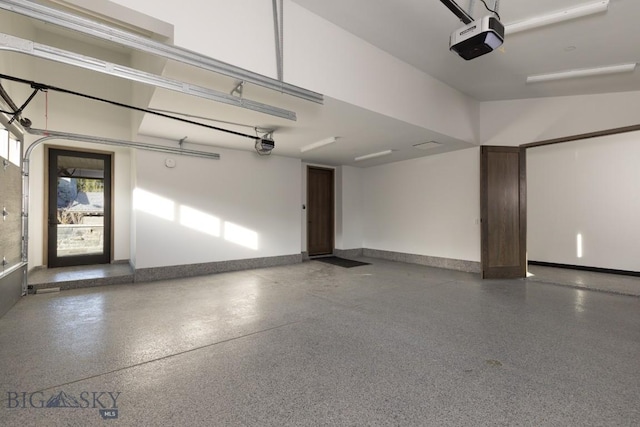 117 Martingale Frk Unit 6, Big Sky, MT 59716 - garage with a garage door opener and baseboards