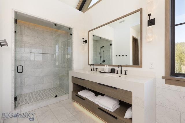 bathroom featuring vanity and a shower with door