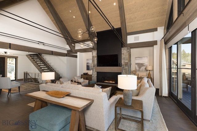 living room with wooden ceiling, dark wood-type flooring, high vaulted ceiling, beamed ceiling, and a large fireplace