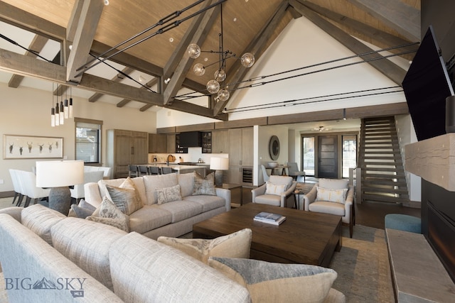 living room with beam ceiling, wooden ceiling, and high vaulted ceiling