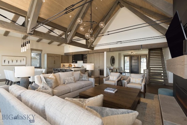 117 Martingale Frk Unit 6, Big Sky, MT 59716 - living room featuring high vaulted ceiling and beam ceiling