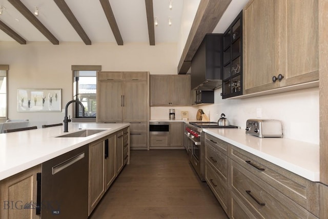 117 Martingale Frk Unit 6, Big Sky, MT 59716 - kitchen with a sink, stainless steel appliances, beamed ceiling, light countertops, and dark wood finished floors