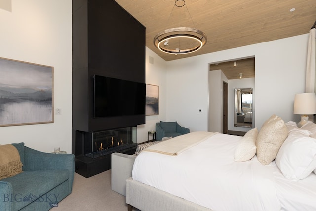 bedroom with light carpet and wood ceiling