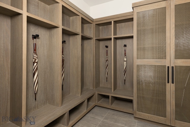 mudroom with tile patterned floors