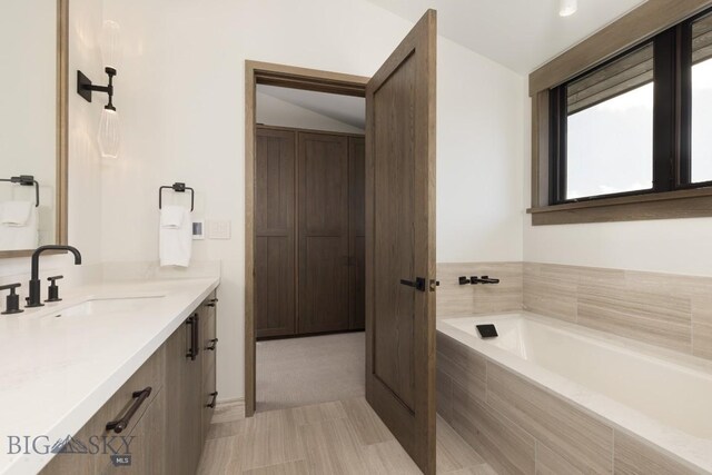 117 Martingale Frk Unit 6, Big Sky, MT 59716 - full bath with vanity, a garden tub, and lofted ceiling