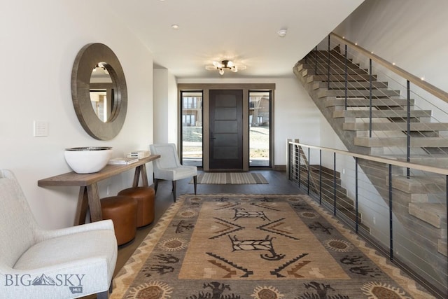 117 Martingale Frk Unit 6, Big Sky, MT 59716 - foyer entrance featuring wood finished floors and stairway