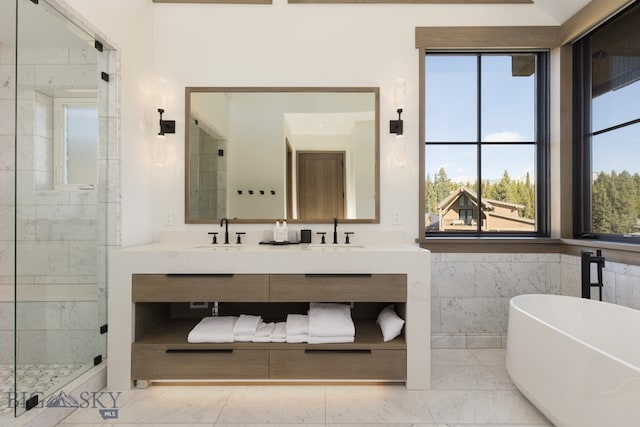 bathroom with tile patterned floors, vanity, and independent shower and bath