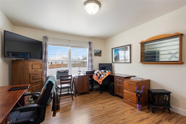 office area with light hardwood / wood-style flooring