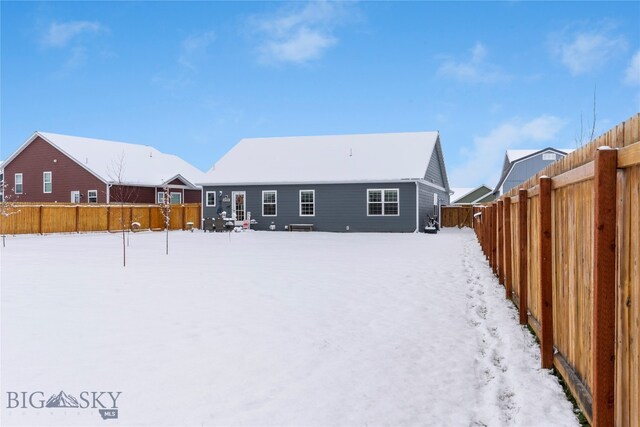 view of snow covered house